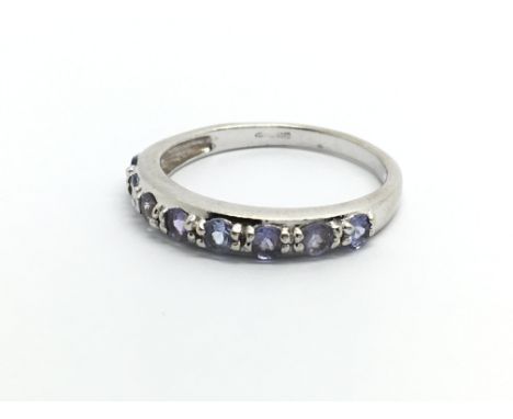 A 9carat white gold ring set with Tanzanite and diamonds ring size N.