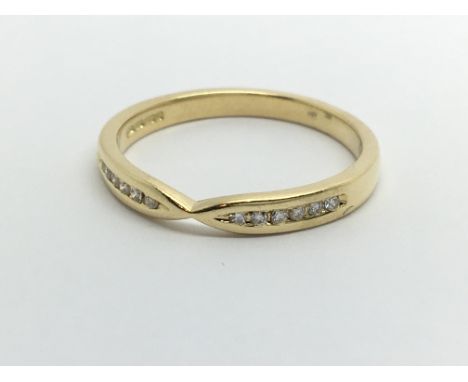 An 18carat gold ring set with a row of diamonds ring size N.
