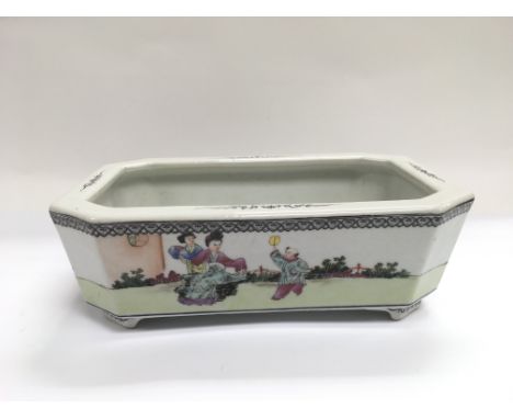 A late Republic planter with painted decoration of digures in a garden setting, approx width 24.5cm.