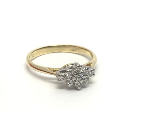 An 18ct gold nine stone diamond cluster ring, approx.25ct, approx 2.2g and approx size H-I.