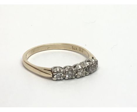 A 14ct gold five stone diamond ring, approx .25ct, approx 1.7g and approx size L-M.
