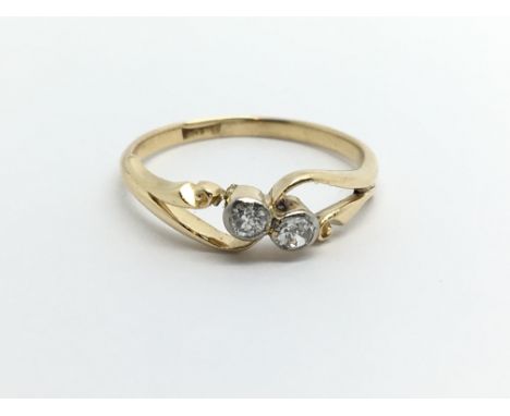 A vintage 18ct gold two stone diamond ring, approx.20ct, approx 2g and approx size L.