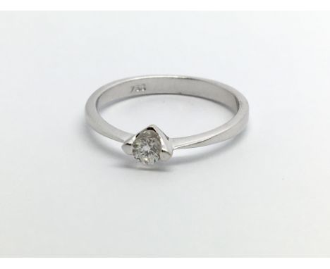 An 18ct white gold solitaire diamond ring, approx .12ct, approx 1.7g and approx size K.