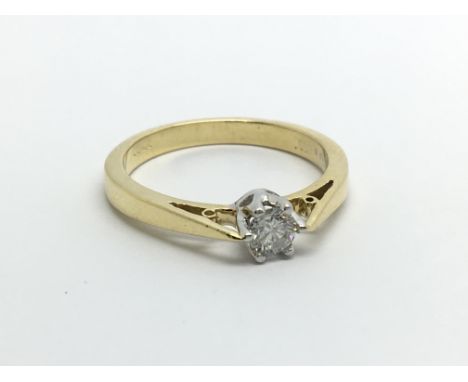 An 18ct gold solitaire diamond ring, approx 1/4ct, approx 3.9g and approx size N.
