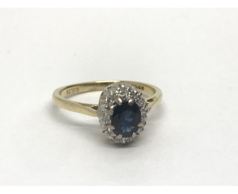 An 18ct gold sapphire and diamond cluster ring, approx 2.8g and approx size H.