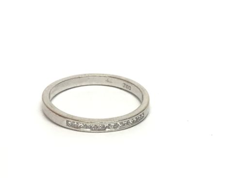 An 18ct white gold half eternity diamond ring set with princess cut diamonds, approx .25ct, approx 2.4g and approx size M-N.