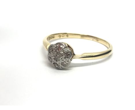 A vintage 18ct gold seven stone diamond ring in the form of a flowerhead, approx 2g and approx size N-O.