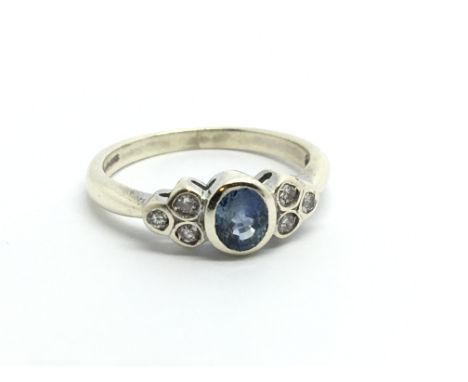 A 9ct white gold six stone diamond and sapphire ring, approx 2.4g and approx size J-K.