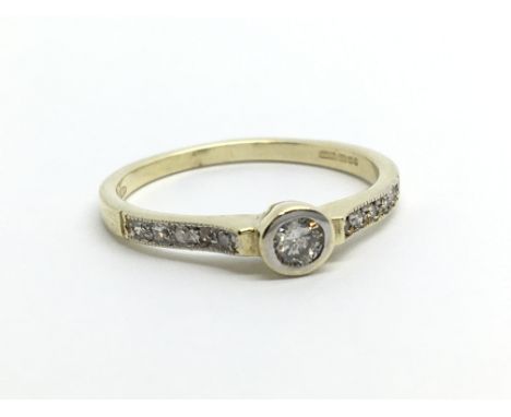 A 9ct gold ten point solitaire diamond ring, approx 1.6g and approx size M.