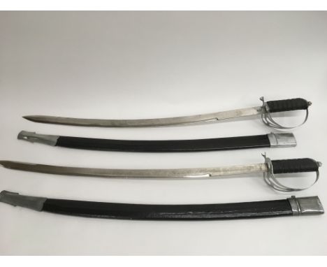 Two replica Indian army swords and sheaths.