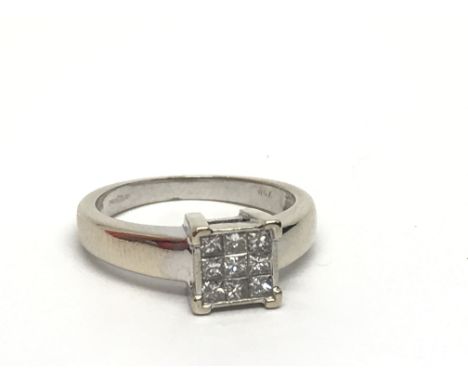 An 18ct white gold nine stone diamond ring set with princess cut diamonds, approx.25ct, approx 3.8g and approx size I-J.