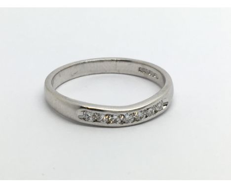 An 18ct white gold seven stone diamond ring, approx.15ct, approx 2.9g and approx size N.