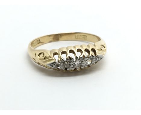 A vintage 18ct gold ring set with five small diamonds, approx .10ct, approx 3g and approx size J-K.
