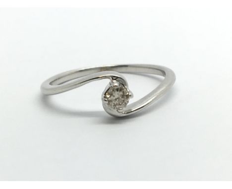 A 9ct white gold solitaire diamond ring, approx .10ct, approx 1.2g and approx size J.