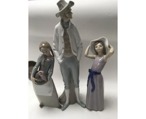 Three Lladro figures together with four others .