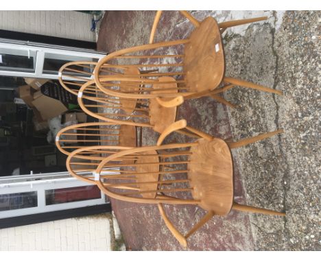 A set of Six light Elm and beechwood Ercol modern design dining chairs including two open arm chairs (6) damage to top rails