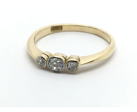 An 18carat gold ring set with three brilliant cut diamonds ring size M-N