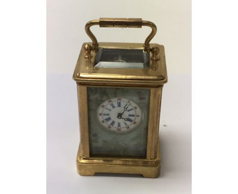 Included is a French porcelain miniature carriage clock