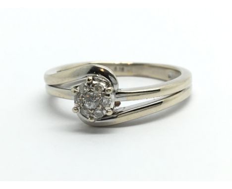 An 18ct white gold seven atone diamond cluster ring, approx 3.4g and approx size K-L.