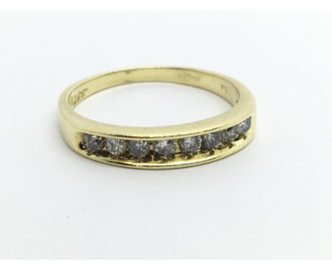 An 18ct gold half eternity diamond ring, approx.33ct, approx 2.6g and approx size M.