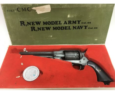 A rare boxed CMC Remington navy cap gun, cal 44. plus a naval and military school exercise book (2).