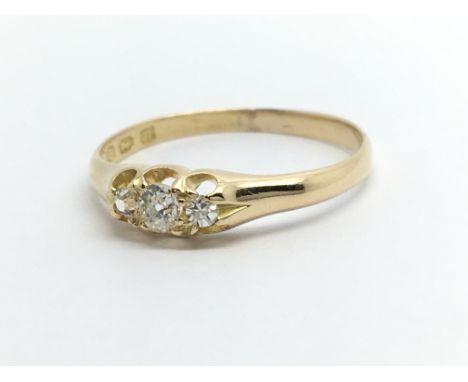 A vintage 18ct gold three stone diamond ring, approx 1.9g and approx size P-Q.