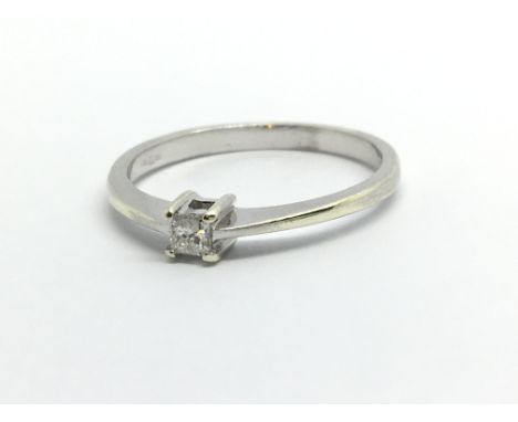 A 9ct white gold solitaire diamond ring set with a single princess cut diamond, approx .10ct, approx 1.6g and approx size M.