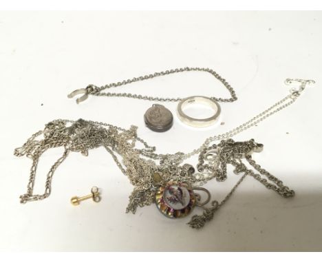 A collection of silver necklaces and white metal jewellery included a silver ring.