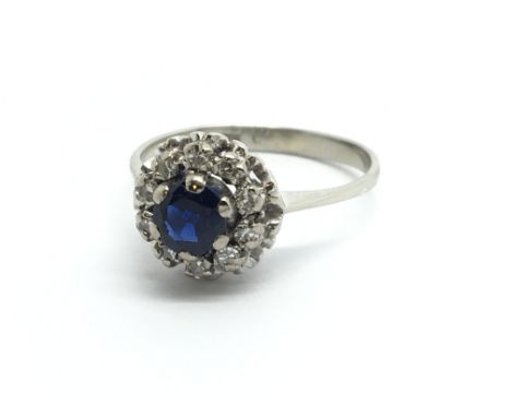 An unmarked white gold sapphire and diamond cluster ring, approx 2.8g and approx size H-I.