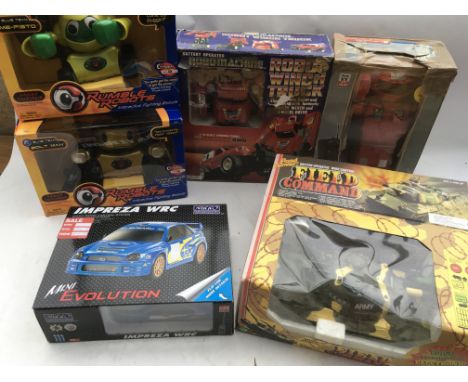 A collection of boxed toys , including Rumble Robots , Me-Fisto and Bolt man. Robo machine, transforms into Winch truck, Talk