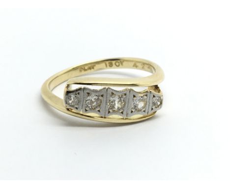 An 18carat gold ring set with five diamonds. Ring size L.