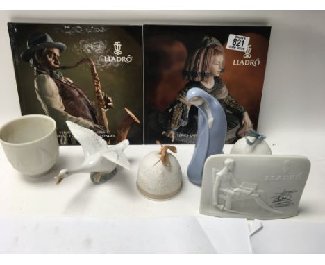 6 Lladro porcelain Items and 2 Lladro books.