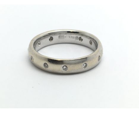 An 18ct white gold eternity diamond ring, approx 4.2 g and approx size J.