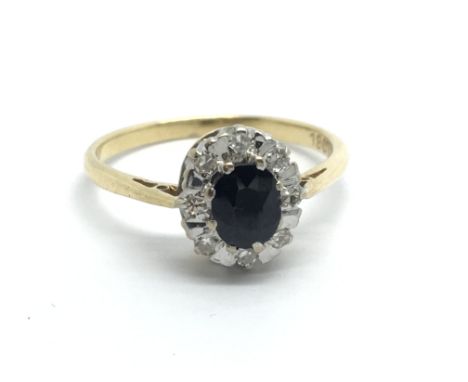 An 18ct gold sapphire and diamond cluster ring, approx 2.3g and approx size K.