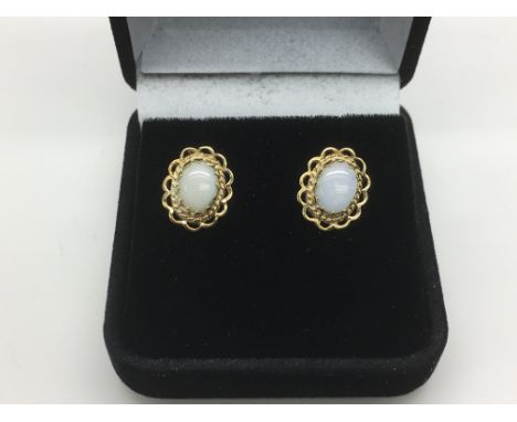 A pair of 9ct gold opal earrings, approx 2g.