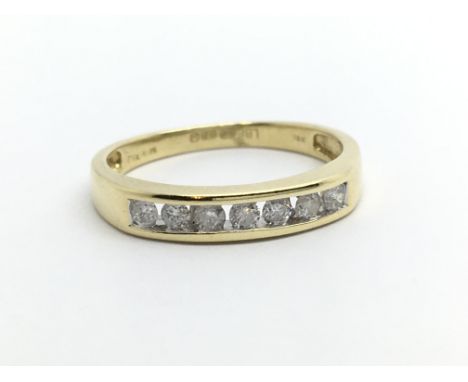 An 18ct gold seven stone half eternity diamond ring, approx 1/4ct, approx 2.6g and approx size L.