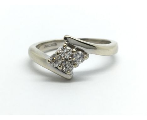 A 9ct white gold four stone diamond ring, approx .20ct, approx 3g and approx size J-K.