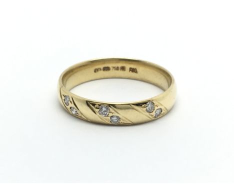 An 18carat gold ring set with six diamonds ring size O-P