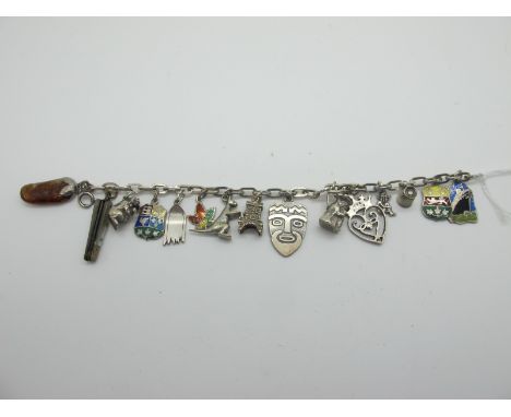 A Vintage Charm Bracelet, suspending assorted novelty charm pendants, including a miniature two blade folding knife, with mot