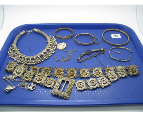 A Decorative Ladies Panel Belt, of pierced design, to rectangular panel buckle, overall length 72.5cm, an upper arm bangle (i
