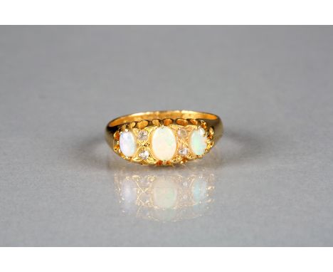 Ladies 22 carat gold opal and diamond ring, three mounted oval opals interspaced between small diamonds 