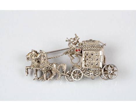 Silver and Marcasite brooch, in the form of a horse drawn carriage, the carriage door opening to reveal a square dialled fift