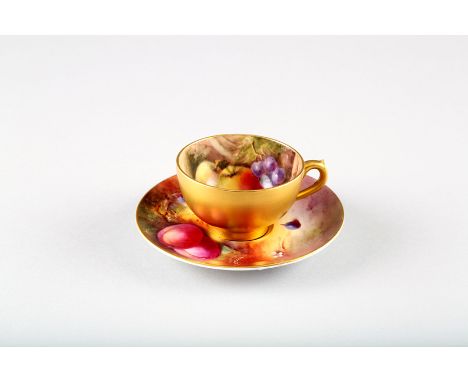 Royal Worcester coffee cup and saucer, decorated with hand painted fallen fruit, signed Ricketts and Cole 