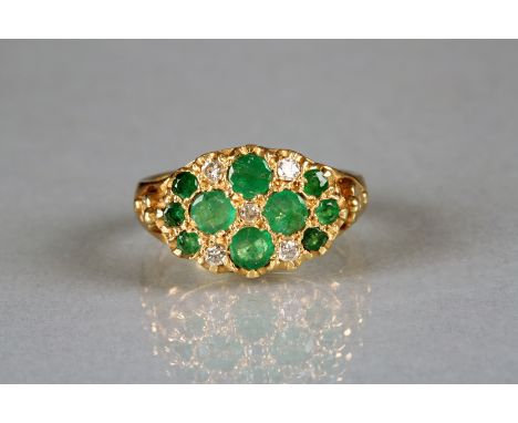 Ladies 18 carat gold emerald and diamond ring, ten mounted emeralds interspaced with small diamonds 