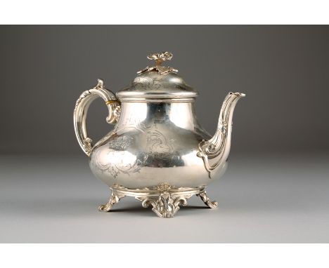 Victorian silver tea pot, floral finial, chased scroll work decoration with scroll handle, raised on swept scroll feet, Assay