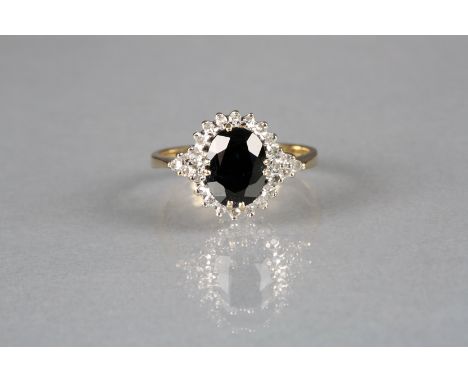 Ladies 9 carat gold dark blue sapphire and diamond ring 