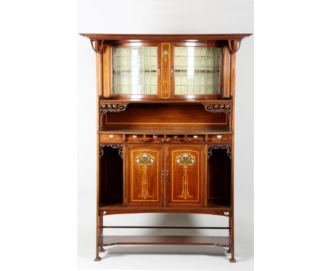 Arts and Crafts inlaid mahogany cabinet, rectangular flat stepped cornice over a bow fronted cabinet with a pair of leaded gl