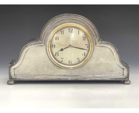 Liberty and Co., an Arts and Crafts Tudric pewter clock, model 01492, planished double ogee domed form, with fluted border, o