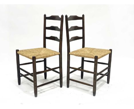Lawrence Neal after Ernest Gimson, a pair of Cotswold School Clisset ladder back chairs, circa 1960s, with rush seats, three 