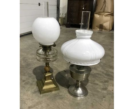 A late Victorian brass oil lamp, stepped base, clear facet glass reservoir, opaque glass globe shade and chimney, 65cm high, 